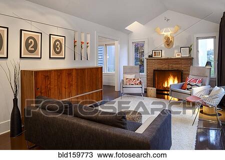 Stock Image - Chair and fireplace in modern living room. Fotosearch