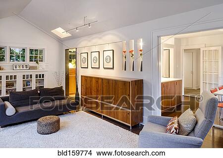 Picture - Chest, armchair and sofas in modern living room. Fotosearch