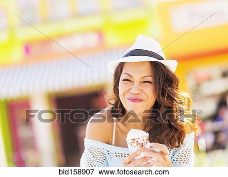 Chinese woman eating ice cream cone View Large Photo Image Stock Photo - Chinese woman eating ice cream cone. Fotosearch