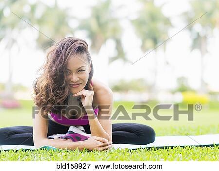 Chinese woman stretching in park View Large Photo Image Stock Photo - Chinese woman stretching in park. Fotosearch