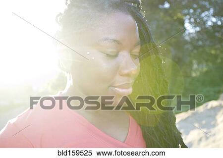 Close up of African American woman with eyes closed View Large Photo Image Stock Photography - Close up of African American woman with eyes closed. Fotosearch