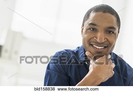 Close up of Black businessman smiling View Large Photo Image Stock Photo - Close up of Black businessman smiling. Fotosearch