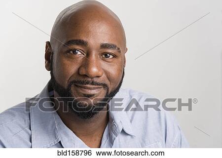 Stock Photograph - Close up of black man smiling. Fotosearch
