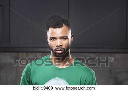 Stock Photo - Close up of Black man with serious expression. Fotosearch