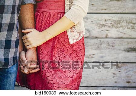 Close up of Caucasian couple holding hands View Large Photo Image Stock Photo - Close up of Caucasian couple holding hands. Fotosearch