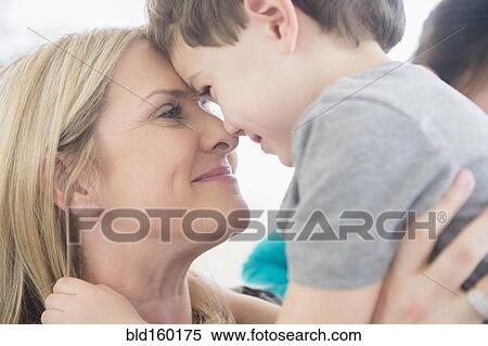 Stock Photography - Close up of Caucasian mother and son touching forehead. Fotosearch