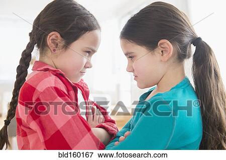 Close up of Caucasian sisters arguing View Large Photo Image Stock Photo - Close up of Caucasian sisters arguing. Fotosearch