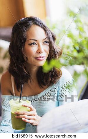 Close up of Chinese woman drinking smoothie View Large Photo Image Stock Photography - Close up of Chinese woman drinking smoothie. Fotosearch