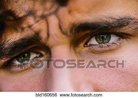 Stock Photograph - Close up of eyes of Hispanic man. Fotosearch