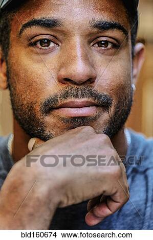 Close up of hand on chin of mixed race man View Large Photo Image Picture - Close up of hand on chin of mixed race man. Fotosearch