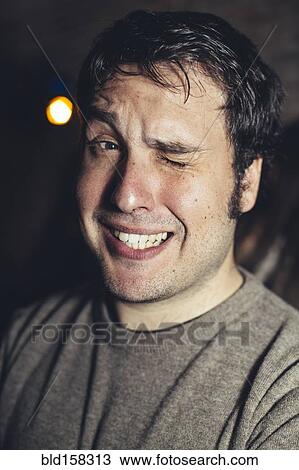 Close up of Hispanic man winking View Large Photo Image Stock Image - Close up of Hispanic man winking. Fotosearch