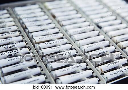 Stock Image - Close up of homeopathic medicine vials. Fotosearch