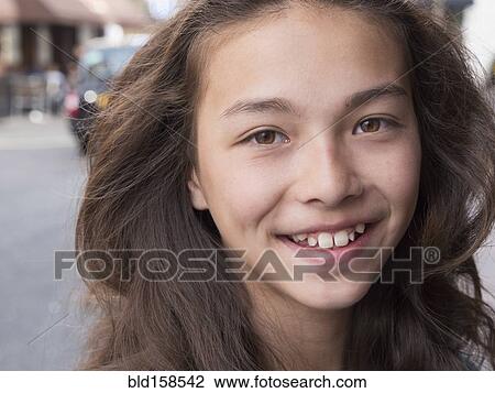 Close up of mixed race girl smiling View Large Photo Image Stock Image - Close up of mixed race girl smiling. Fotosearch