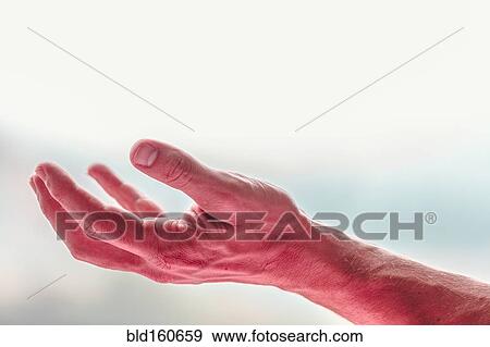 Stock Photo - Close up of reaching hand of Caucasian man. Fotosearch