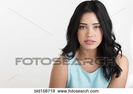 Stock Photo - Close up of serious Hispanic woman. Fotosearch