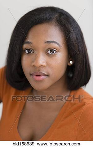 Stock Photo - Close up of serious mixed race woman. Fotosearch