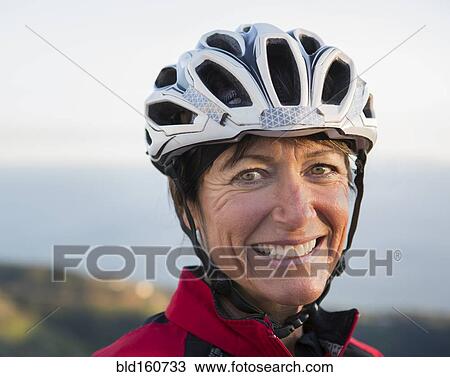 Close up of smiling Caucasian woman wearing helmet View Large Photo Image Stock Image - Close up of smiling Caucasian woman wearing helmet. Fotosearch