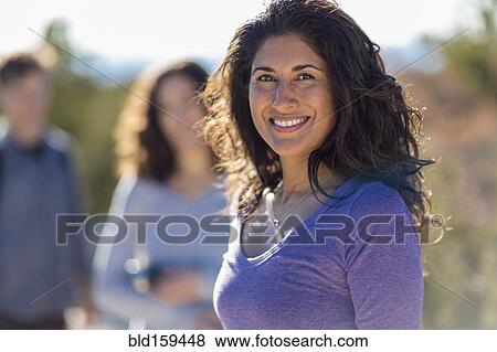 Close up of woman smiling outdoors View Large Photo Image Stock Photo - Close up of woman smiling outdoors. Fotosearch