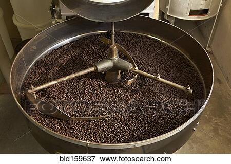 Coffee beans roasting in industrial kettle View Large Photo Image Stock Photo - Coffee beans roasting in industrial kettle. Fotosearch