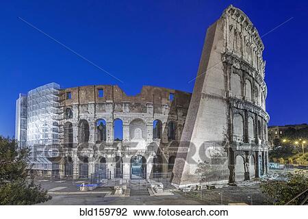 Stock Image - Coliseum ruins illuminated at night, Rome, Italy. Fotosearch