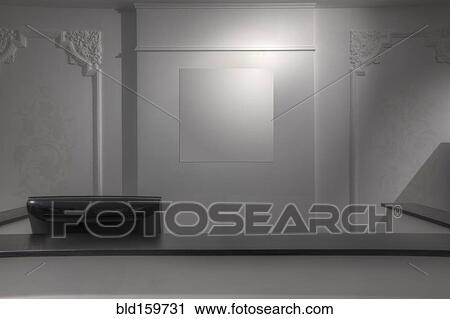 Stock Image - Computer behind empty counter in store. Fotosearch