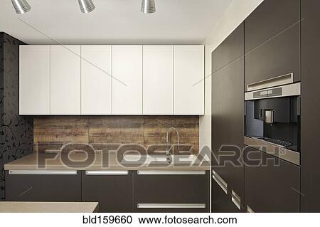 Stock Image - Counters and cabinets in modern kitchen. Fotosearch