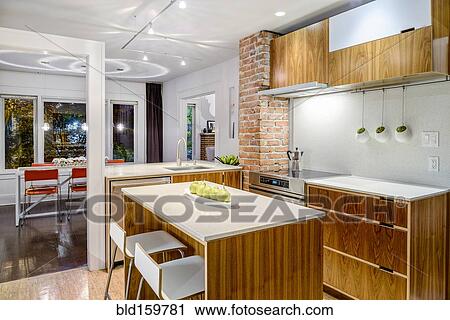 Stock Image - Countertops and breakfast bar in modern kitchen. Fotosearch