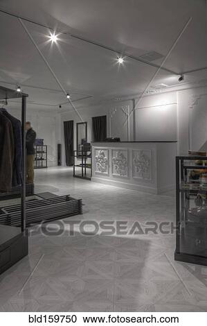 Stock Image - Empty counter in clothing store for men. Fotosearch