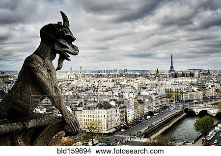 Picture - Gargoyle sculpture over Paris cityscape, Ile-de-France, France. Fotosearch