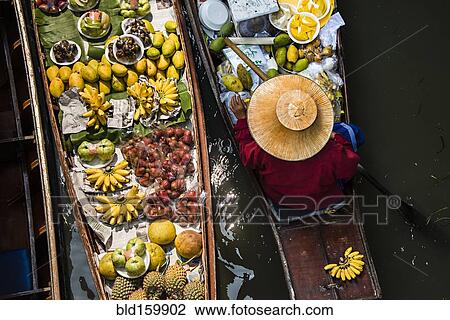 High angle view of merchant selling fruit in canoe View Large Photo Image Stock Image - High angle view of merchant selling fruit in canoe. Fotosearch