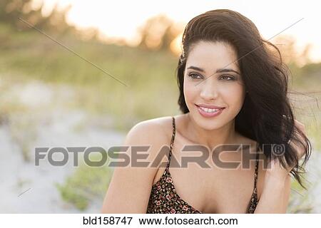 Hispanic woman at beach View Large Photo Image Stock Photo - Hispanic woman at beach. Fotosearch