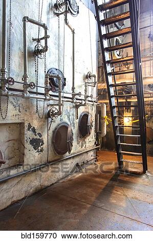 Stock Image - Industrial steam plant machinery in factory. Fotosearch