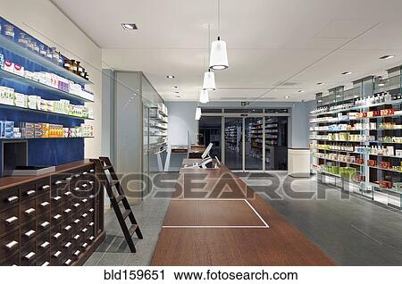 Stock Image - Interior of empty modern pharmacy. Fotosearch