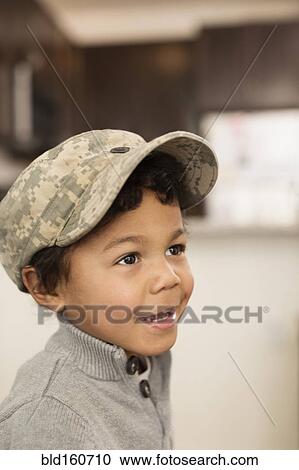 Mixed race boy wearing soldier cap View Large Photo Image Stock Image - Mixed race boy wearing soldier cap. Fotosearch