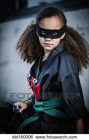 Mixed race girl in martial arts uniform and mask View Large Photo Image Stock Photograph - Mixed race girl in martial arts uniform and mask. Fotosearch