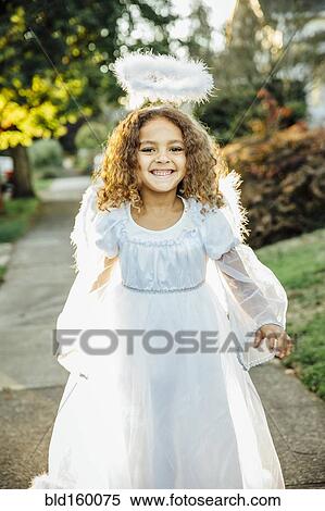 Mixed race girl wearing angel costume on sidewalk View Large Photo Image Stock Photography - Mixed race girl wearing angel costume on sidewalk. Fotosearch