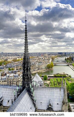 Notre Dame spire over Paris cityscape, Ile-de-France, France View Large Photo Image Stock Photography - Notre Dame spire over Paris cityscape, Ile-de-France, France. Fotosearch