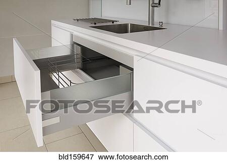 Stock Photo - Open drawer in modern kitchen. Fotosearch