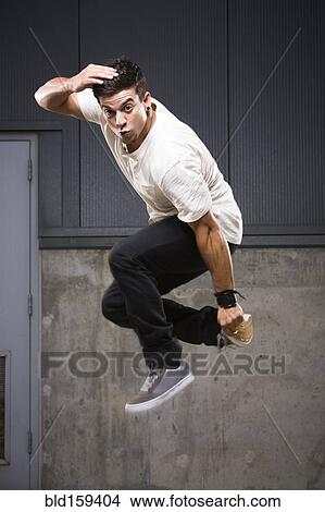 Picture - Pacific Islander dancer jumping. Fotosearch