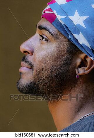Profile of mixed race man wearing American flag turban View Large Photo Image Stock Image - Profile of mixed race man wearing American flag turban. Fotosearch