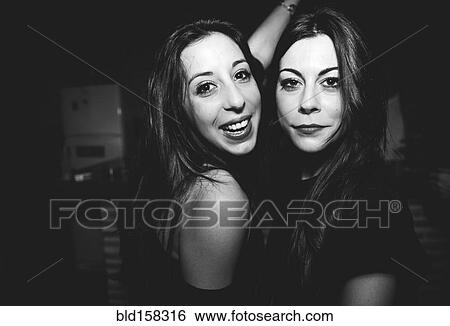 Stock Photograph - Smiling women dancing in nightclub. Fotosearch