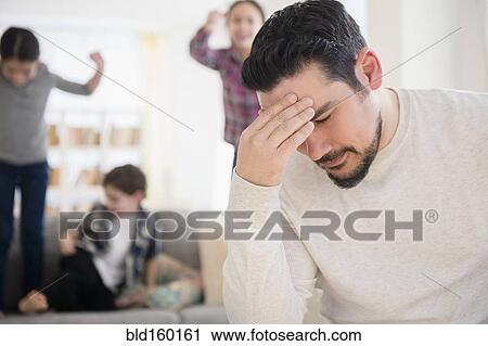 Stressed Caucasian father with shouting children in living room View Large Photo Image Stock Image - Stressed Caucasian father with shouting children in living room. Fotosearch