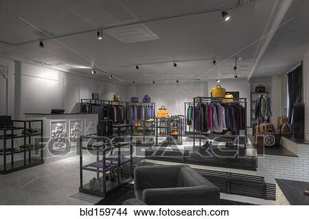 Picture - Suits and shoes in clothing store for men. Fotosearch