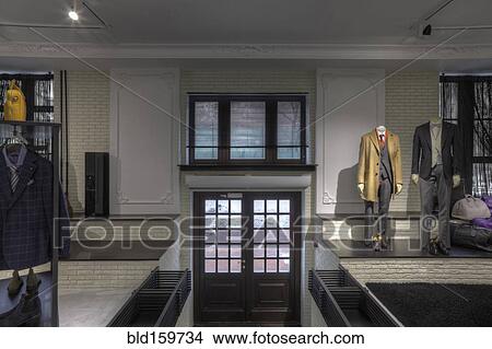 Download Suits on mannequins near doorway of clothing store for men ...