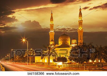 Stock Photograph - Time lapse view of Jumeira Mosque at dusk, Dubai, United Arab Emirates. Fotosearch