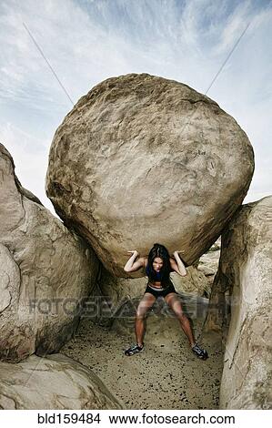 Vietnamese athlete lifting boulder View Large Photo Image Picture - Vietnamese athlete lifting boulder. Fotosearch