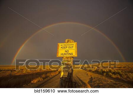 Warning sign in private fields under rainbow View Large Photo Image Stock Image - Warning sign in private fields under rainbow. Fotosearch