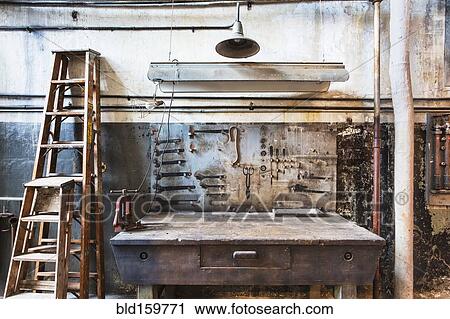 Work bench in rusty factory shop View Large Photo Image Stock Image - Work bench in rusty factory shop. Fotosearch