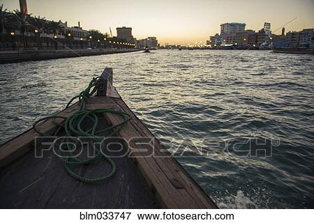 Stock Photo - Canoe on urban canal. Fotosearch