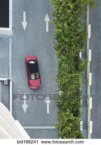 Aerial view of car driving on street with arrows View Large Photo Image Stock Image - Aerial view of car driving on street with arrows. Fotosearch
